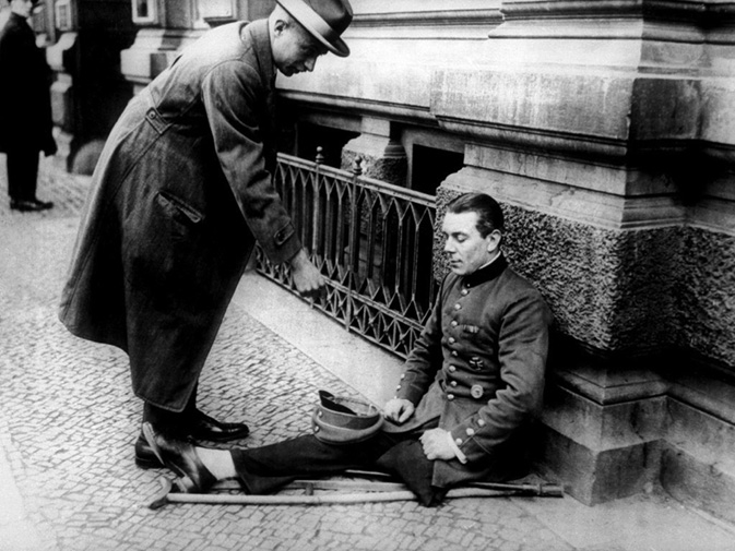A one-legged soldier begging on the streets of Berlin